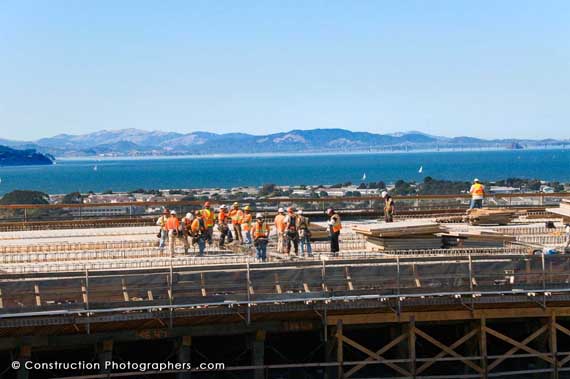 A construction crew is strategizing on the new Oakland Bay Bridge.